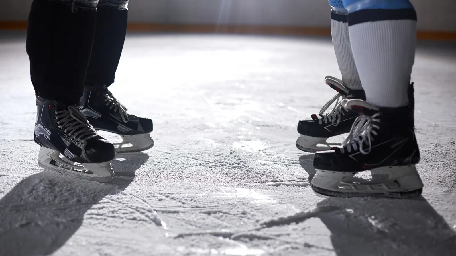 Close-up of ice skates on a skating rink